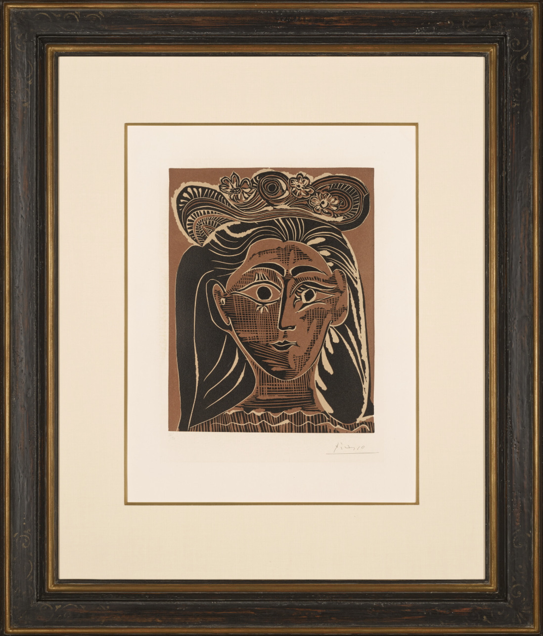 Pablo Picasso, portrait of a woman in a flowered hat, linocut in colours. Shown in colour up to the share of fees collected.